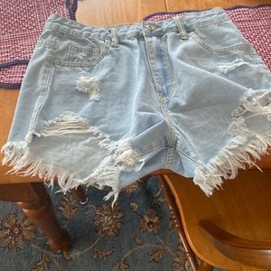 Color is blue. They are jean shorts from shein or a woman size medium
